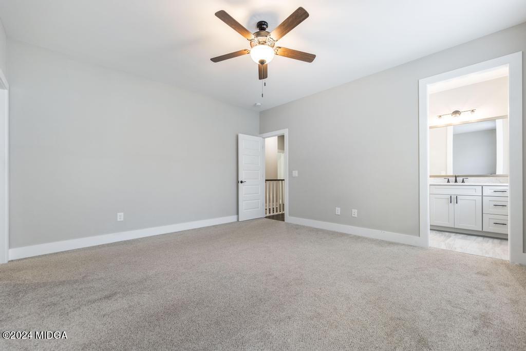 411 Crescent Drive Forsyth, GA 31029 - Photo 36 of 57 a view of an empty room with a window