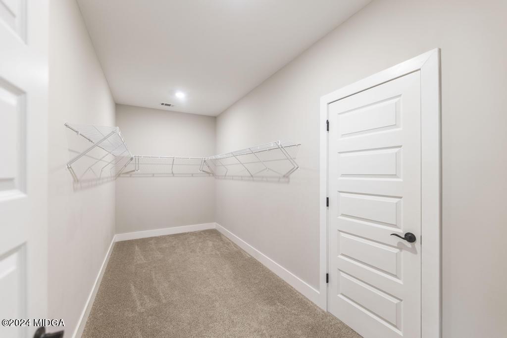 411 Crescent Drive Forsyth, GA 31029 - Photo 37 of 57 a view of a room with racks on the wall