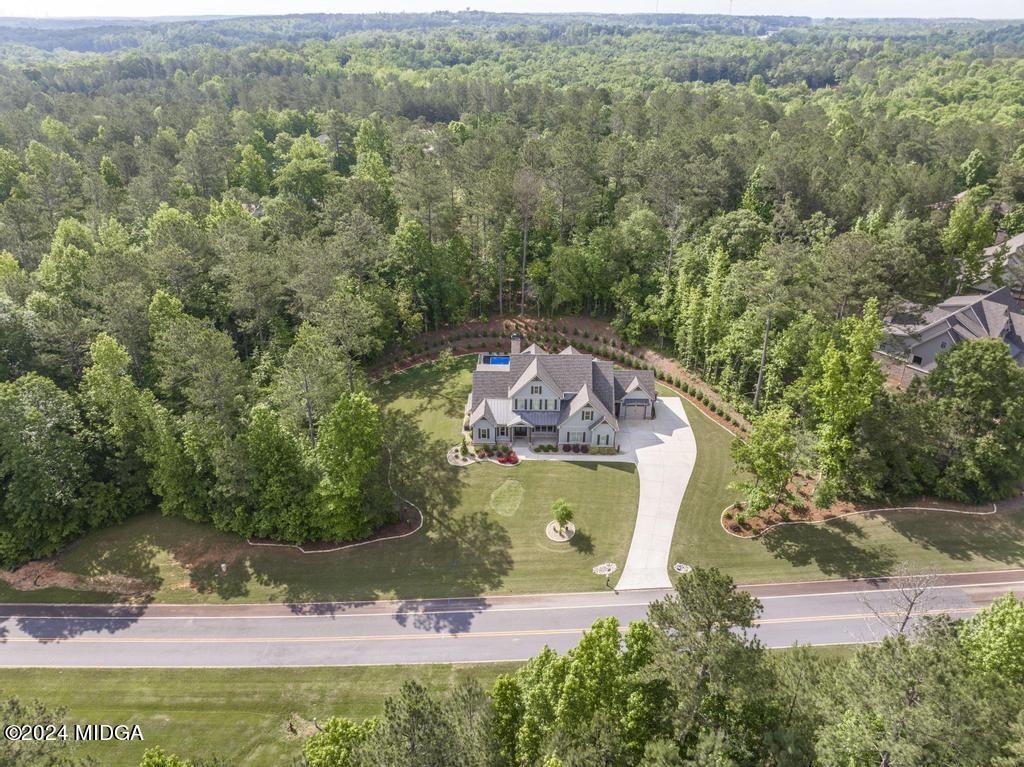 411 Crescent Drive Forsyth, GA 31029 - Photo 4 of 57 an aerial view of a house with a yard