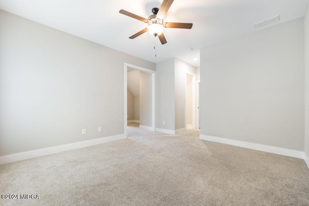 411 Crescent Drive Forsyth, GA 31029 - Photo 42 of 57 a view of an empty room