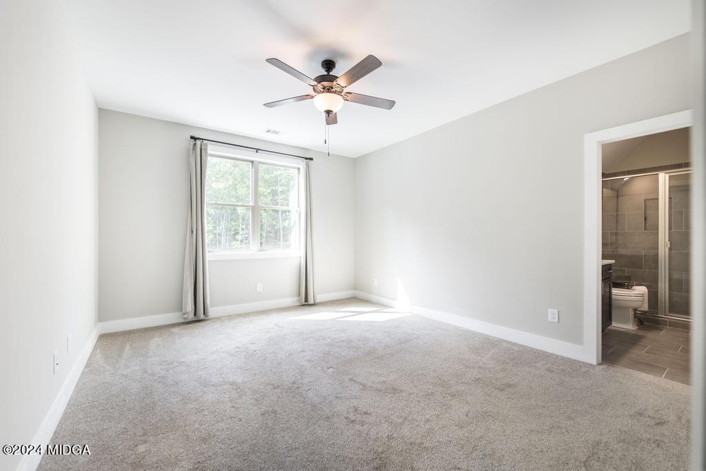 411 Crescent Drive Forsyth, GA 31029 - Photo 44 of 57 a view of an empty room with a window