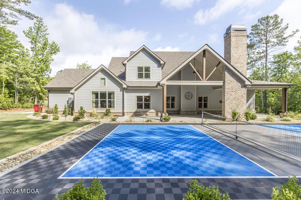 411 Crescent Drive Forsyth, GA 31029 - Photo 52 of 57 a view of a house with a swimming pool and a yard
