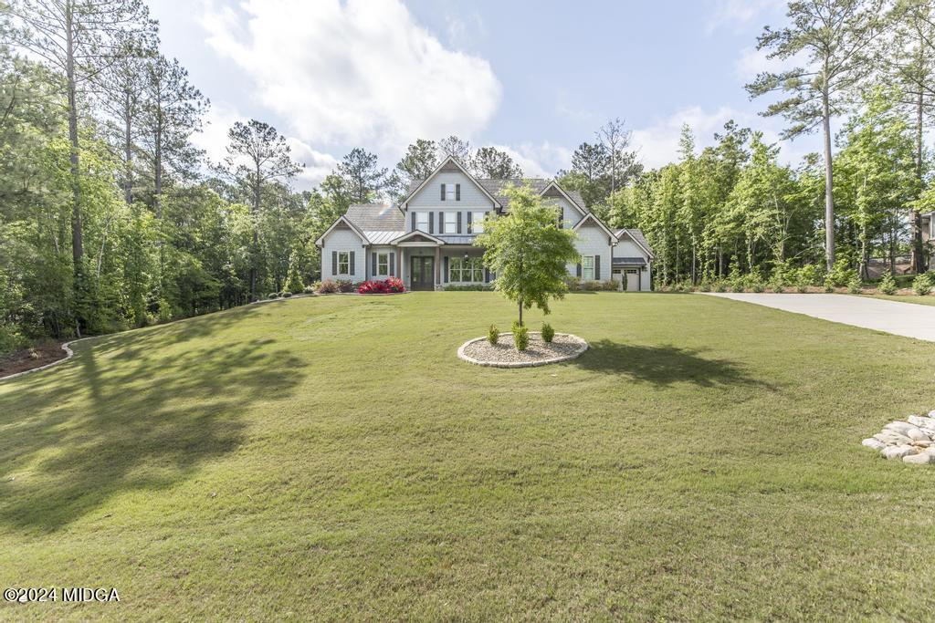 411 Crescent Drive Forsyth, GA 31029 - Photo 7 of 57 a view of a house with a yard