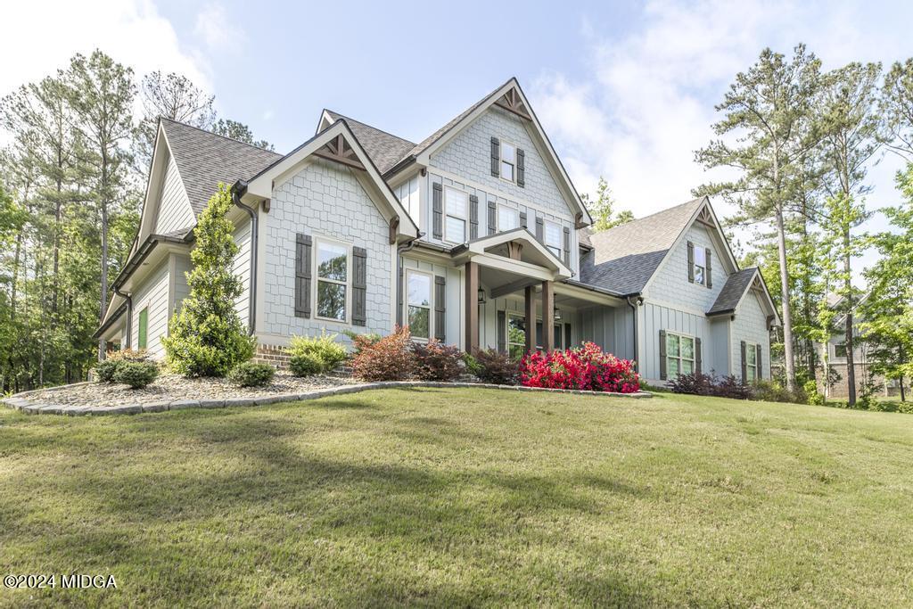411 Crescent Drive Forsyth, GA 31029 - Photo 9 of 57 a front view of house with yard and green space