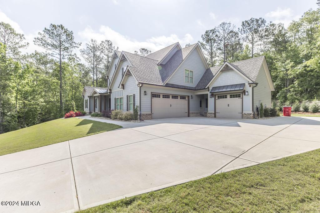 411 Crescent Drive Forsyth, GA 31029 - Photo 10 of 57 a house with trees in the background