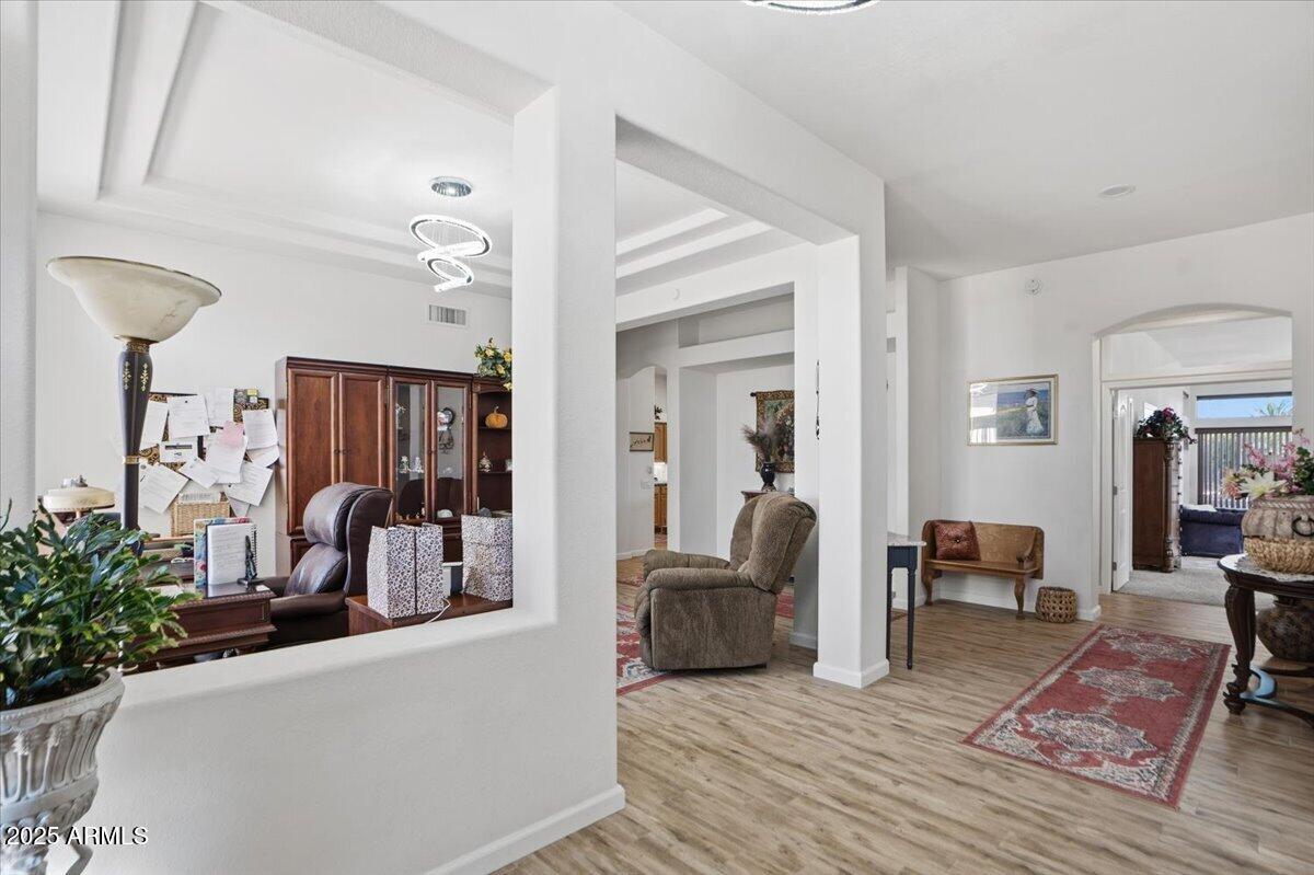 22318 North Dusty Trail Boulevard Sun City West, AZ 85375 - Photo 11 of 66 a living room with furniture and a couch