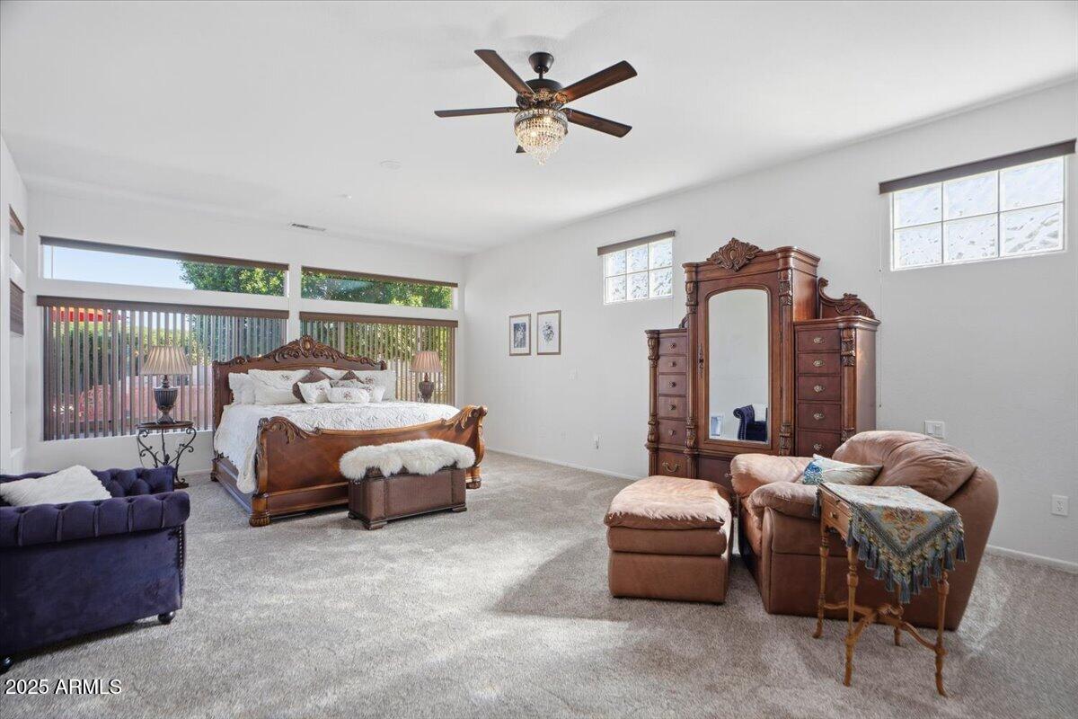 22318 North Dusty Trail Boulevard Sun City West, AZ 85375 - Photo 26 of 66 a bedroom with bed and window