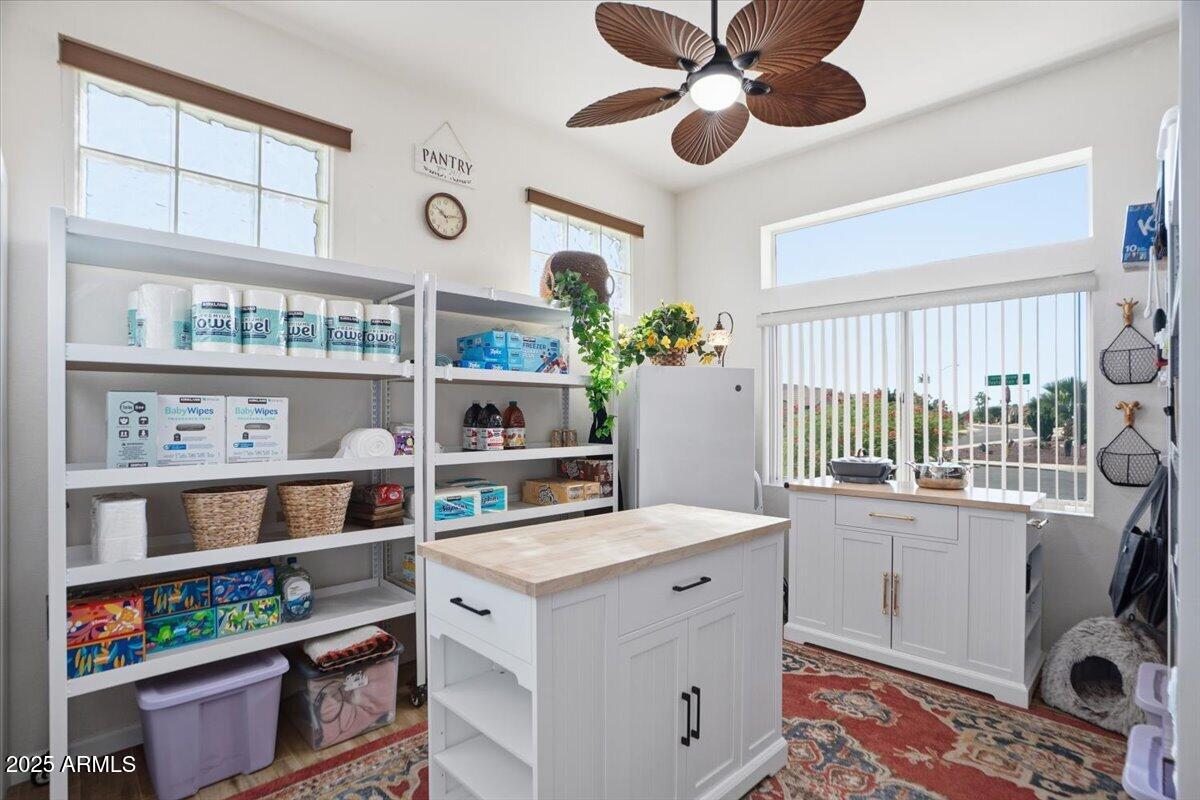 22318 North Dusty Trail Boulevard Sun City West, AZ 85375 - Photo 34 of 66 a utility room with stainless steel appliances cabinets and a window
