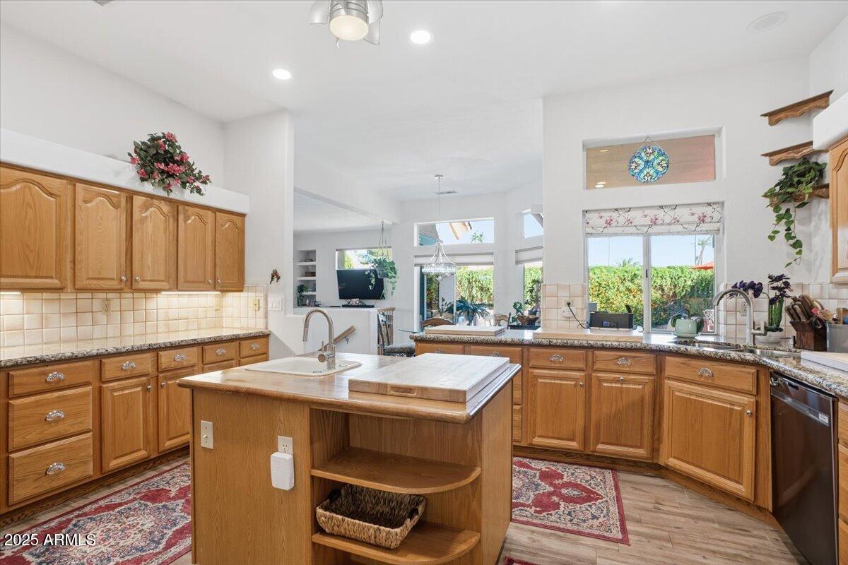 22318 North Dusty Trail Boulevard Sun City West, AZ 85375 - Photo 2 of 66 a kitchen with a sink stove and cabinets