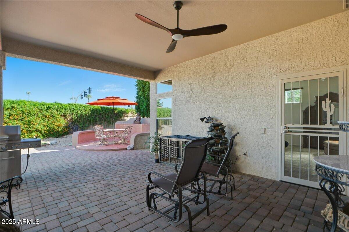 22318 North Dusty Trail Boulevard Sun City West, AZ 85375 - Photo 41 of 66 a view of a dining room with furniture and front door