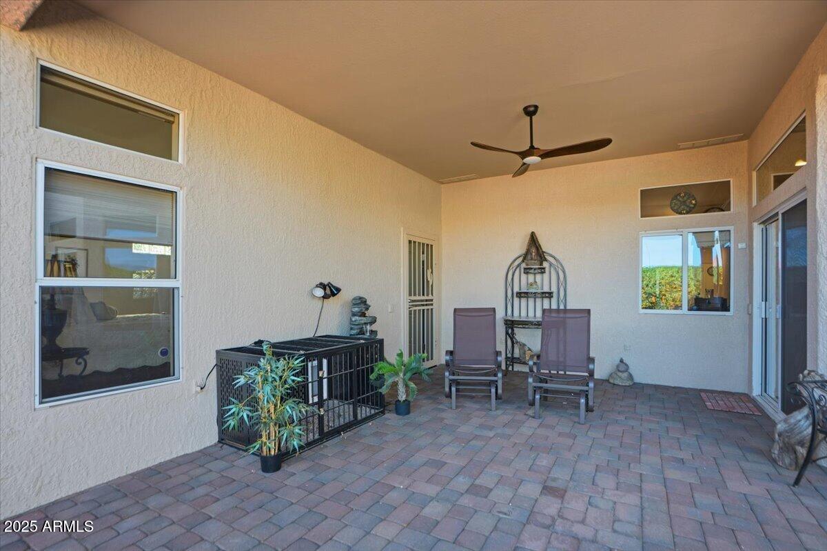 22318 North Dusty Trail Boulevard Sun City West, AZ 85375 - Photo 42 of 66 a view of a workspace with furniture and a window
