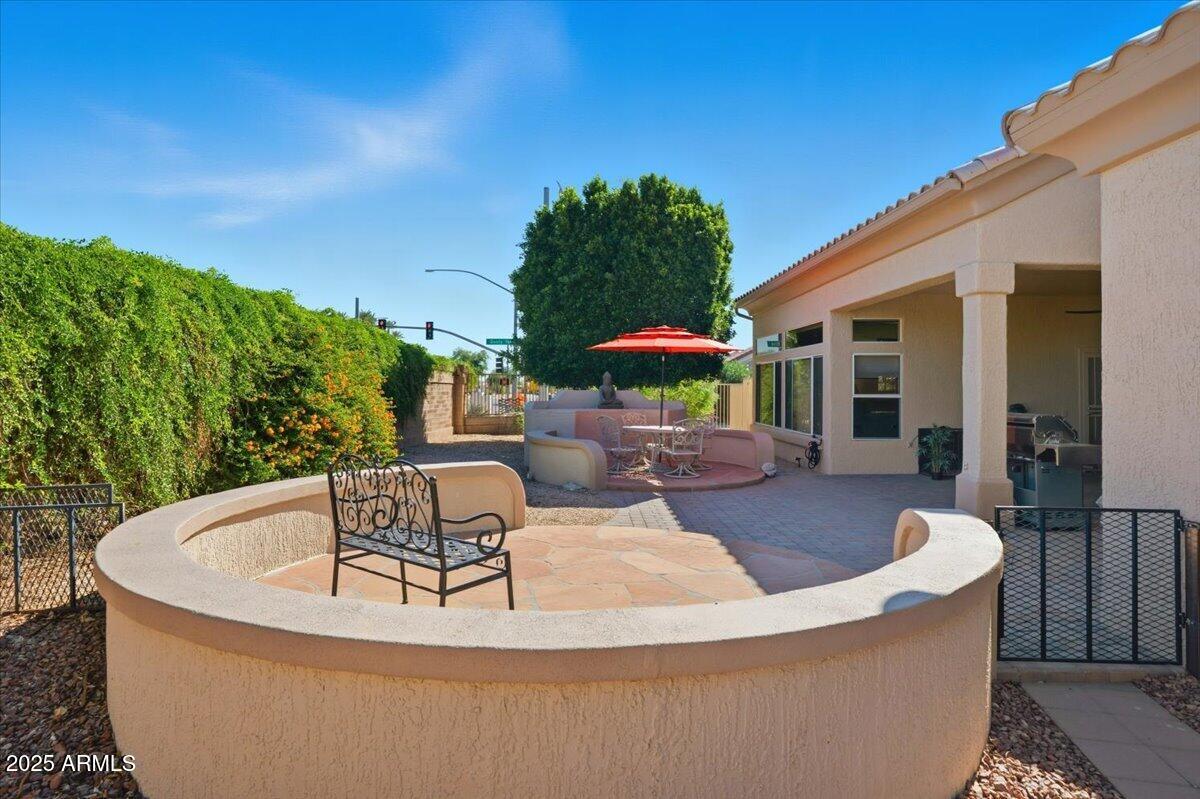 22318 North Dusty Trail Boulevard Sun City West, AZ 85375 - Photo 47 of 66 a view of a house with swimming pool and sitting area