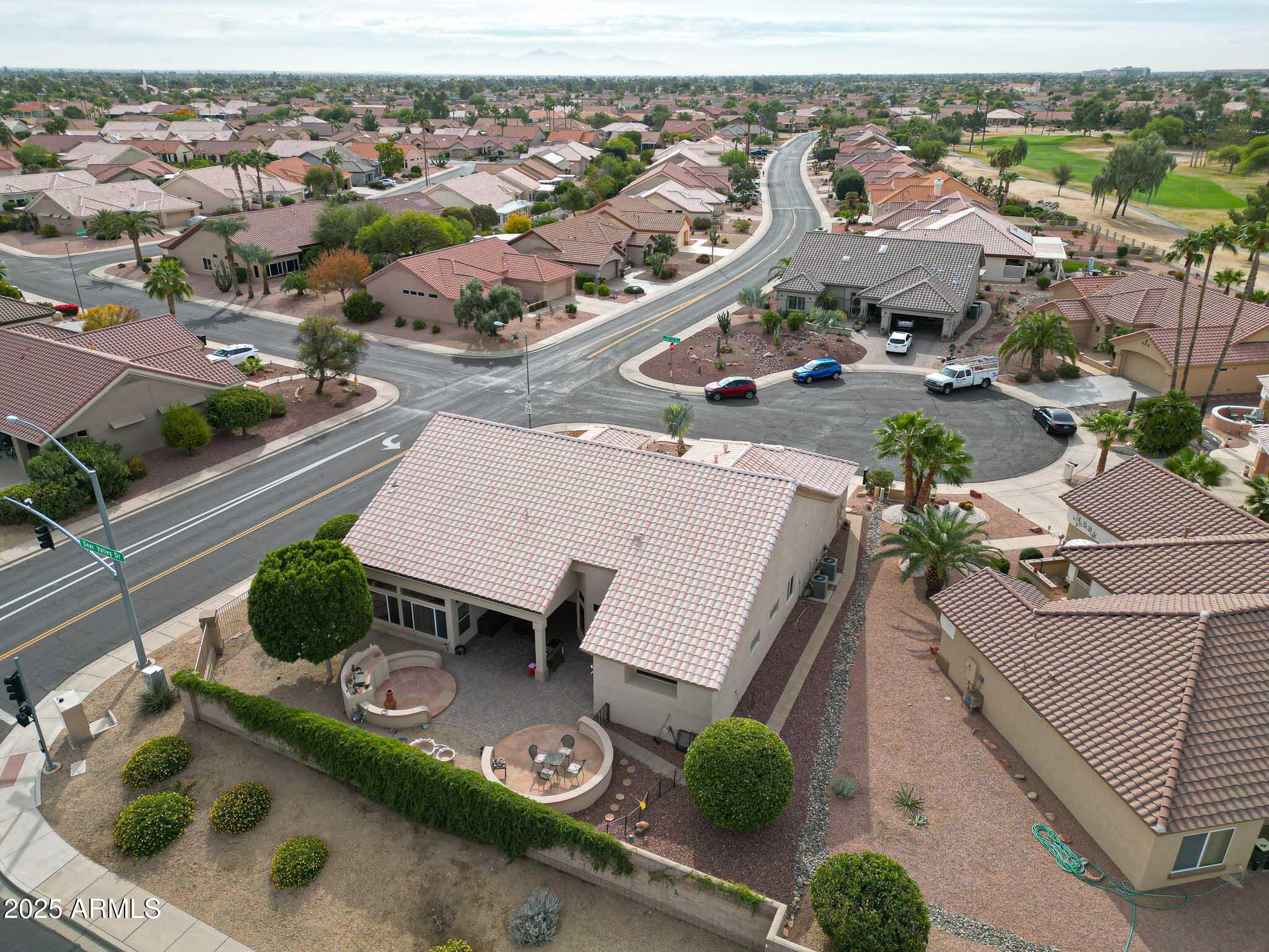 22318 North Dusty Trail Boulevard Sun City West, AZ 85375 - Photo 54 of 66 an aerial view of a house with garden space and street view