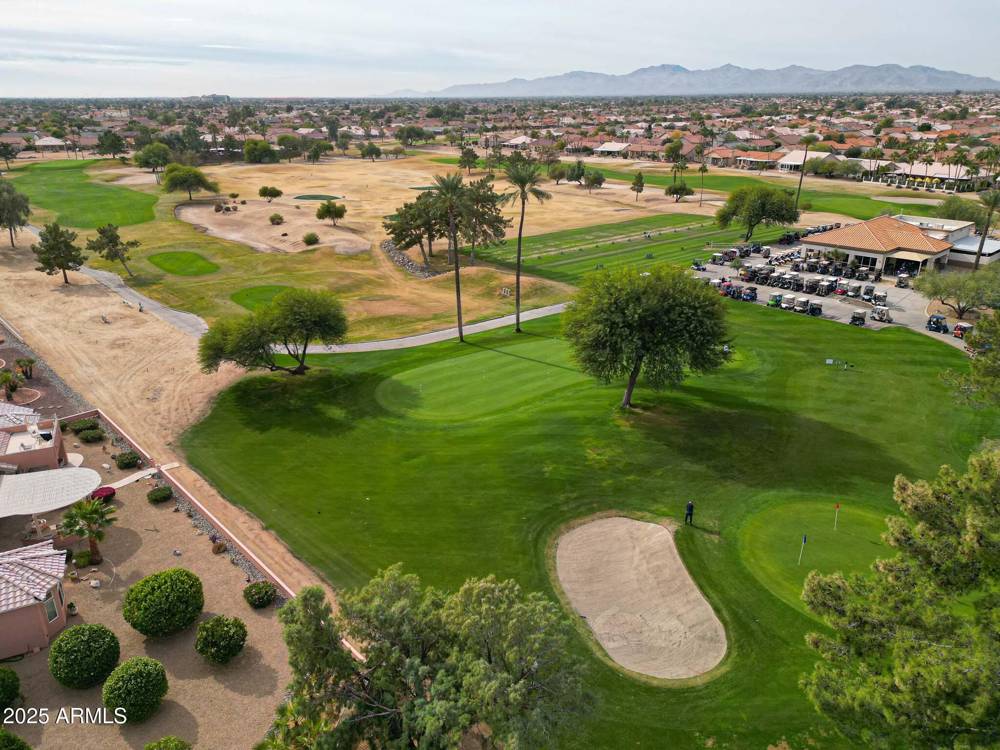 22318 North Dusty Trail Boulevard Sun City West, AZ 85375 - Photo 57 of 66 an aerial view of a residential houses with outdoor space and trees