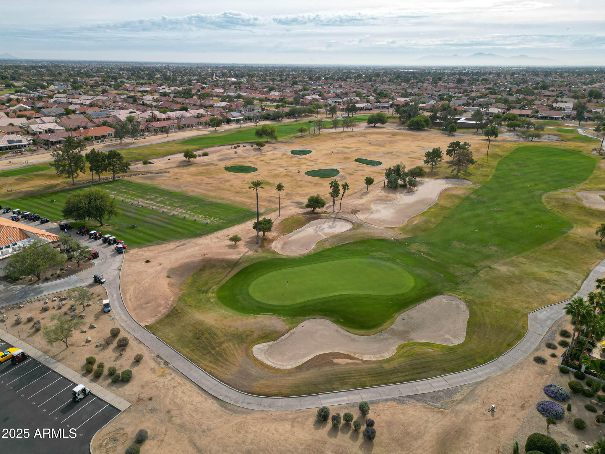 22318 North Dusty Trail Boulevard Sun City West, AZ 85375 - Photo 58 of 66 an aerial view of a house with a yard and lake