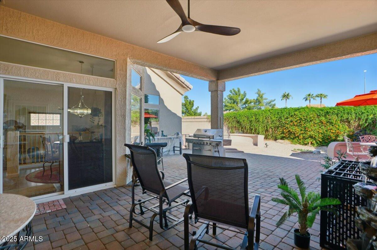 22318 North Dusty Trail Boulevard Sun City West, AZ 85375 - Photo 5 of 66 a dining room with furniture and a potted plant