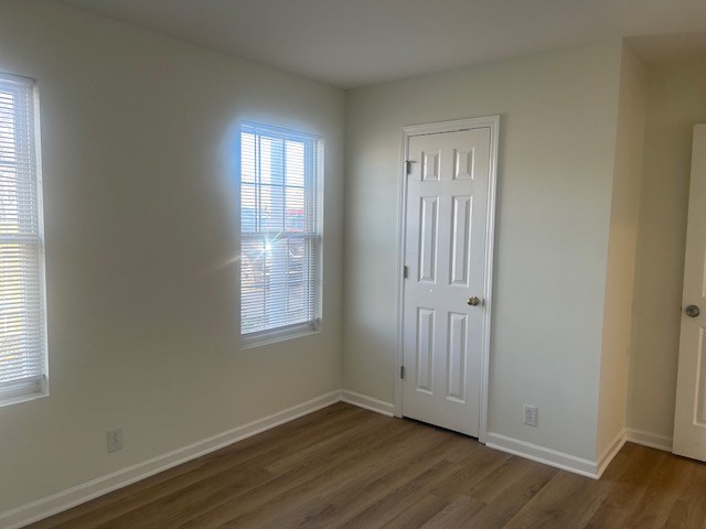337 Pawnee Trail Murfreesboro, TN 37128 - Photo 18 of 40 an empty room with wooden floor and windows