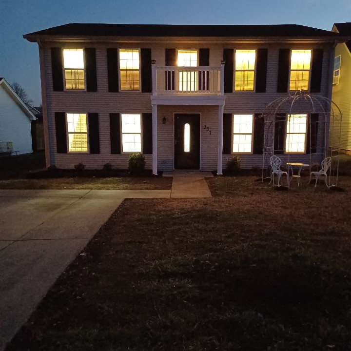 337 Pawnee Trail Murfreesboro, TN 37128 - Photo 2 of 40 a view of brick building with many windows and yard