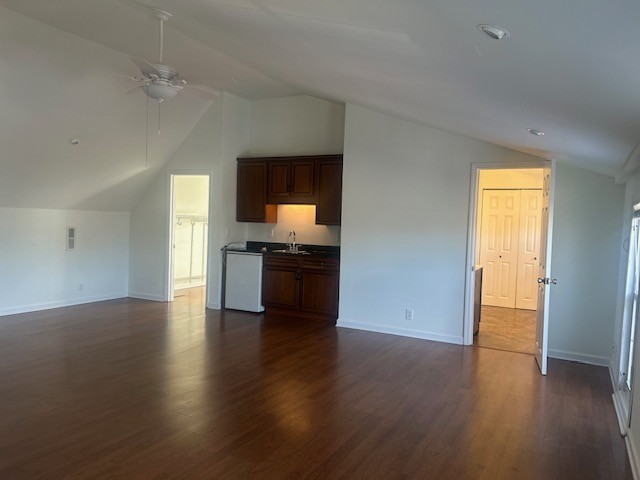 337 Pawnee Trail Murfreesboro, TN 37128 - Photo 28 of 40 an empty room with wooden floor and kitchen view