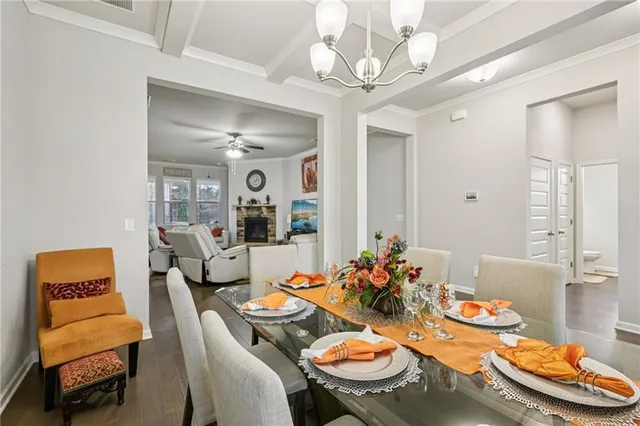 a dining room with furniture and window
