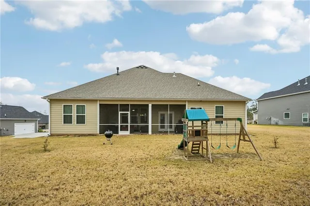 a house view with a sitting space and garden space