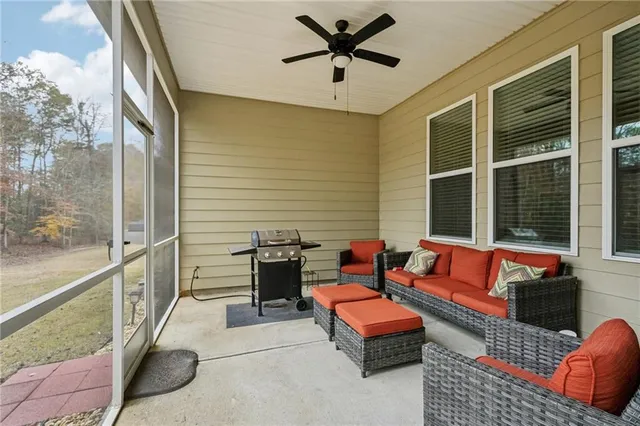 a outdoor living space with patio furniture and a potted plant