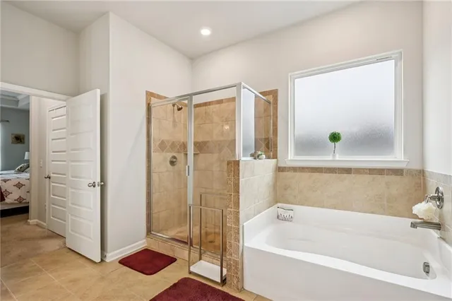 a bathroom with a bathtub and a shower