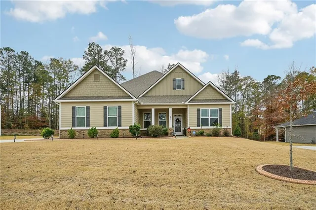 a front view of a house with a yard