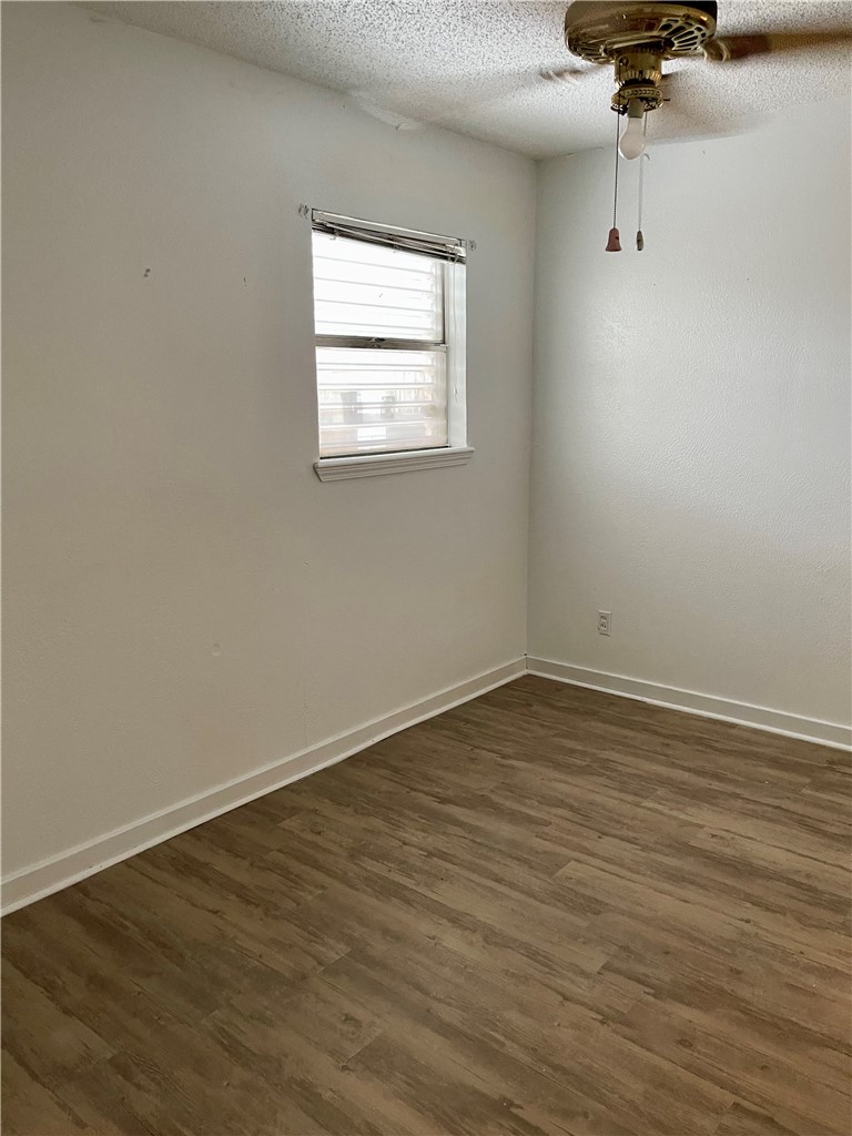 1101 Dewey Avenue Alice, TX 78332 - Photo 8 of 17 an empty room with a window