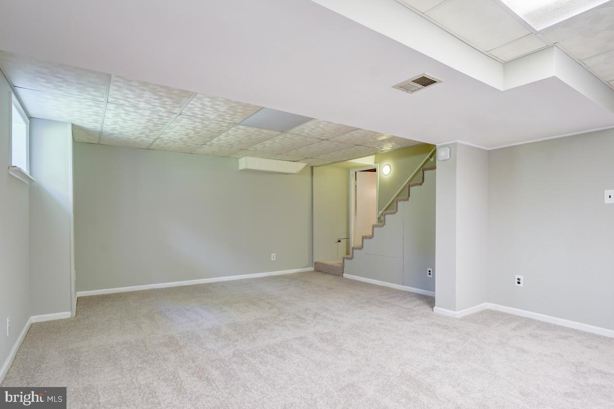 4611 Strathblane Place Alexandria, VA 22304 - Photo 27 of 34 Lower level family room with new carpet