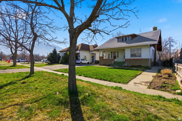 869 West Center Street Provo, UT 84601 - Photo 1 of 32 View of front of property with a chimney, brick siding, and a front yard