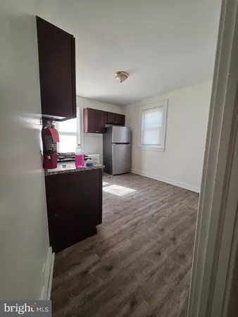 a room with wooden floor and window