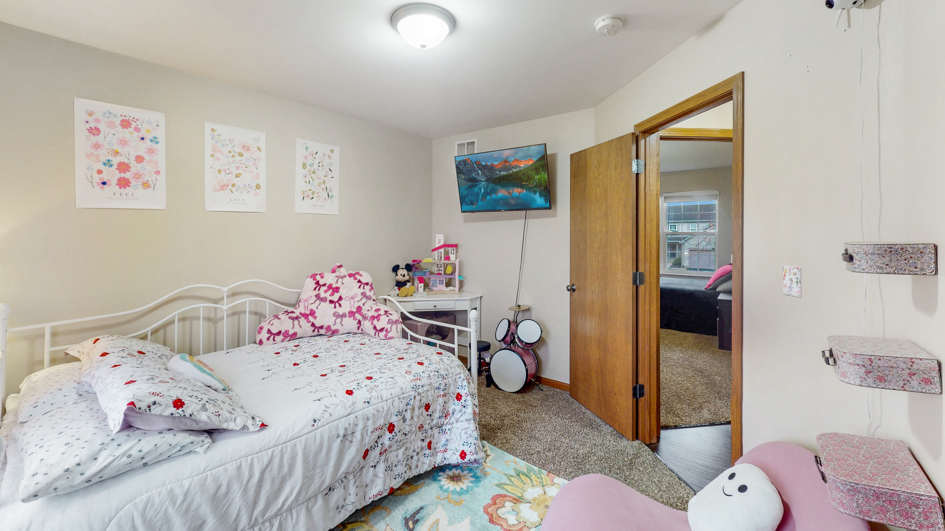 535 Alyssa Street Plano, IL 60545 - Photo 15 of 28 a bedroom with a bed and wooden floor