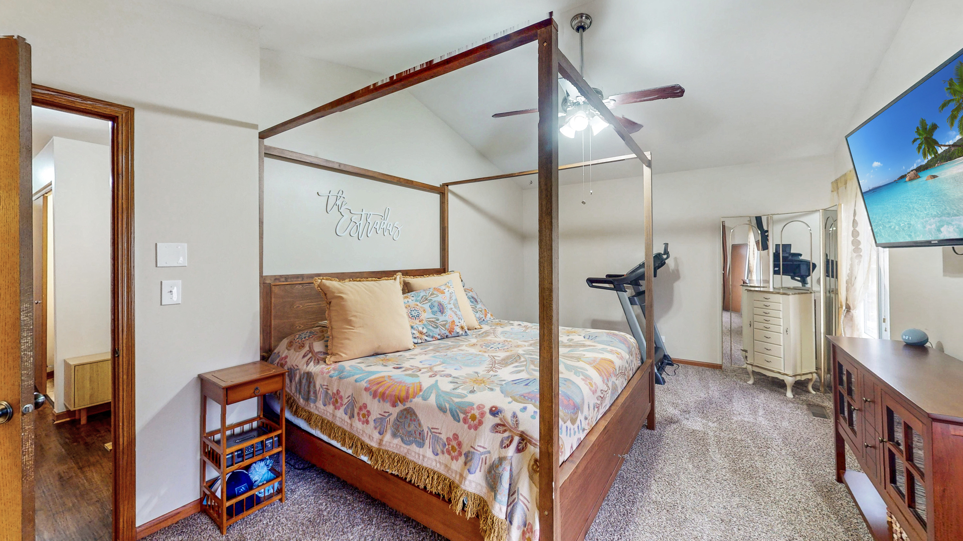 535 Alyssa Street Plano, IL 60545 - Photo 19 of 28 a bedroom with a bed a mirror and a lamp on table