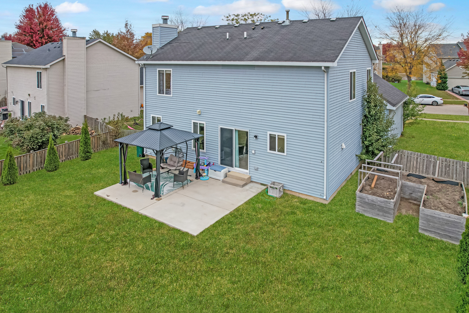 535 Alyssa Street Plano, IL 60545 - Photo 24 of 28 a view of a house with patio and a yard