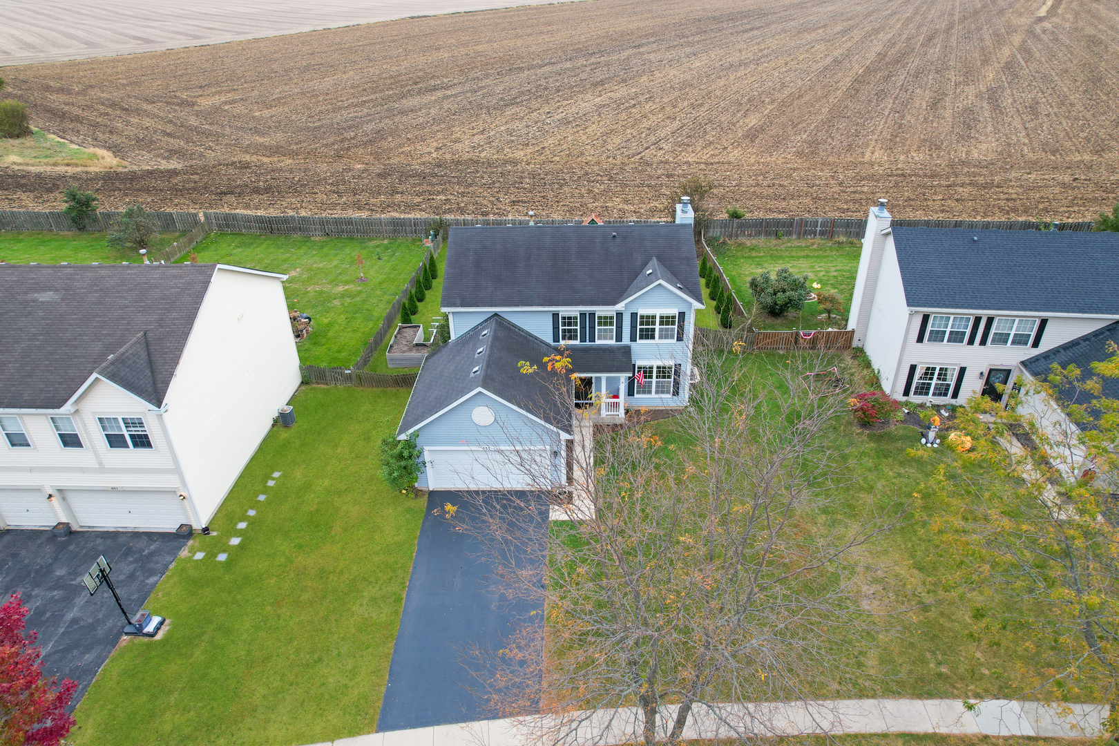 535 Alyssa Street Plano, IL 60545 - Photo 4 of 28 an aerial view of a house with garden space and a car park