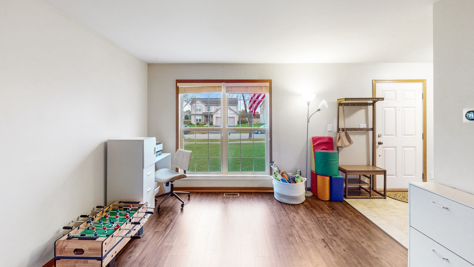 535 Alyssa Street Plano, IL 60545 - Photo 8 of 28 a living room with furniture and a wooden floor