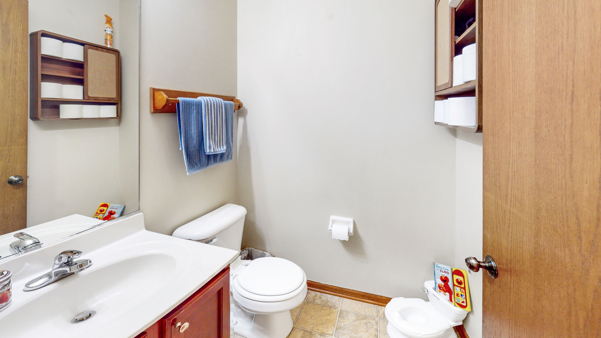 535 Alyssa Street Plano, IL 60545 - Photo 9 of 28 a bathroom with a sink vanity mirror and toilet