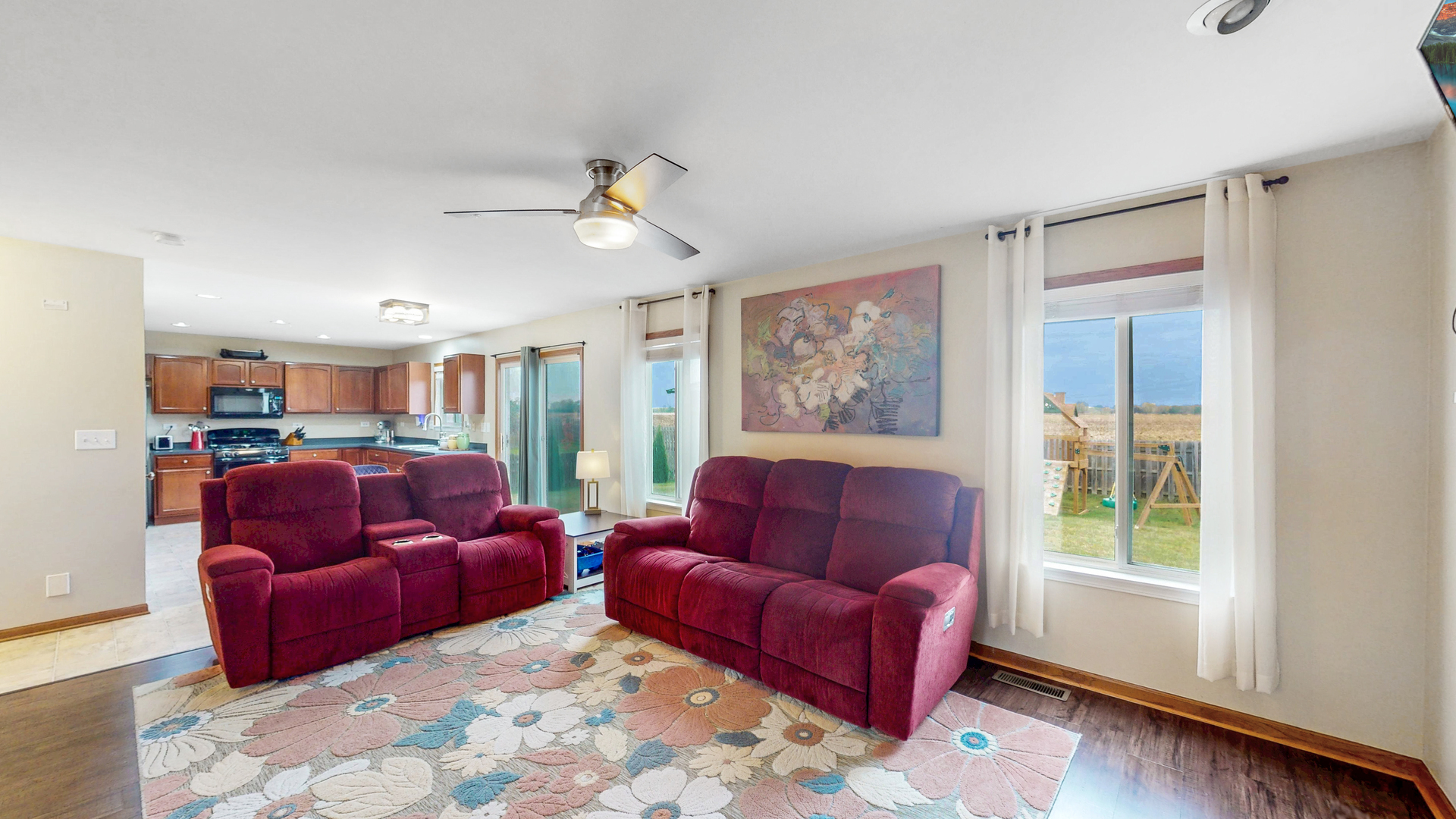 535 Alyssa Street Plano, IL 60545 - Photo 10 of 28 a living room with furniture a couch and a window