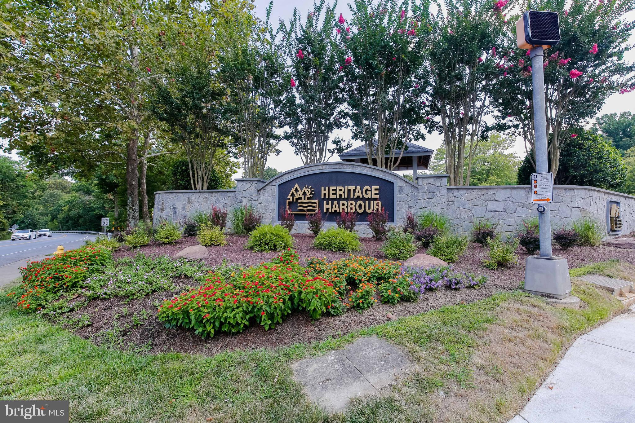 941 Riversedge Circle Annapolis, MD 21401 - Photo 3 of 48 a view of sign board and green space