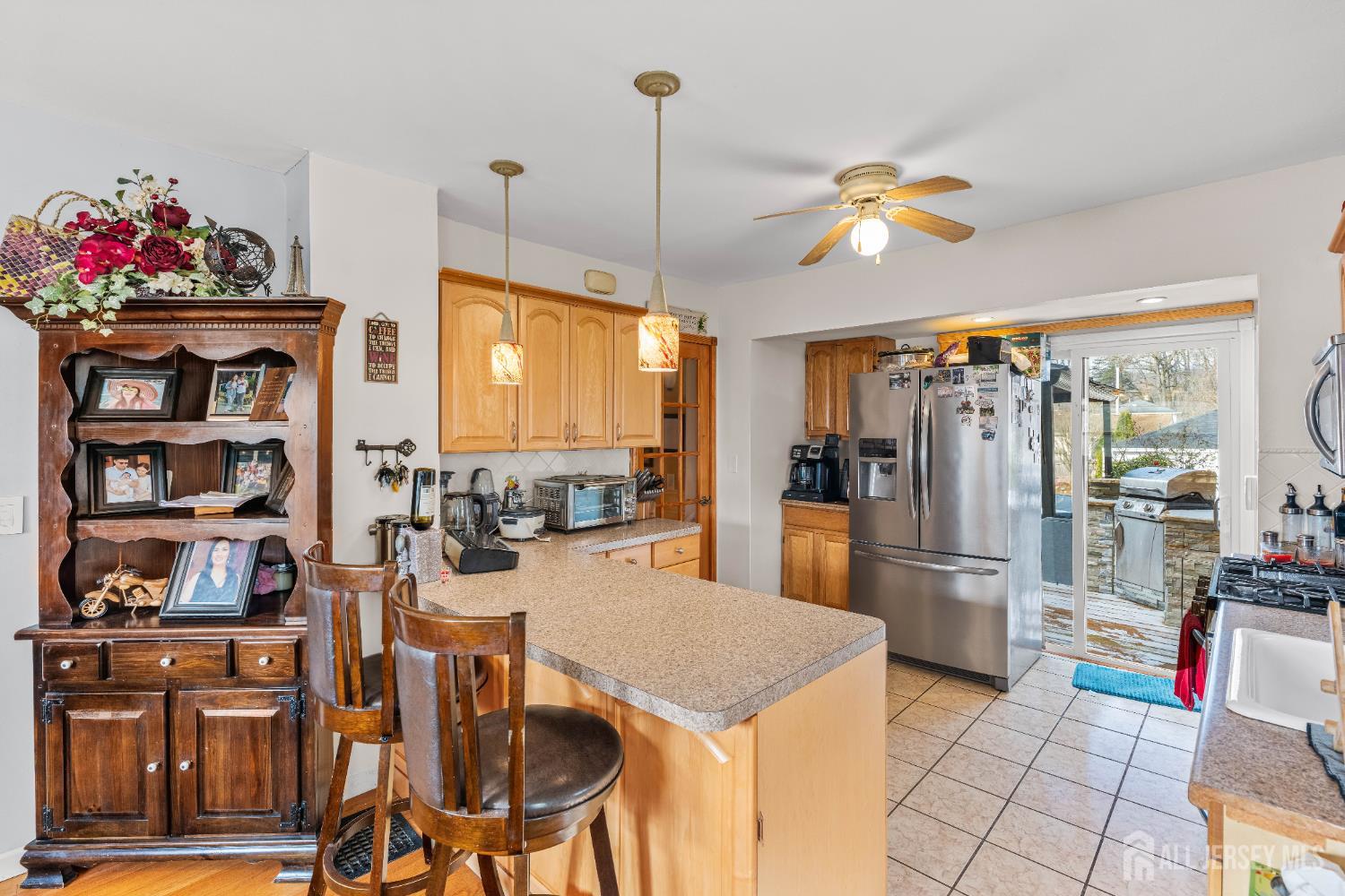 210 2nd Street Dunellen, NJ 08812 - Photo 12 of 42 a kitchen with stainless steel appliances granite countertop a refrigerator and microwave