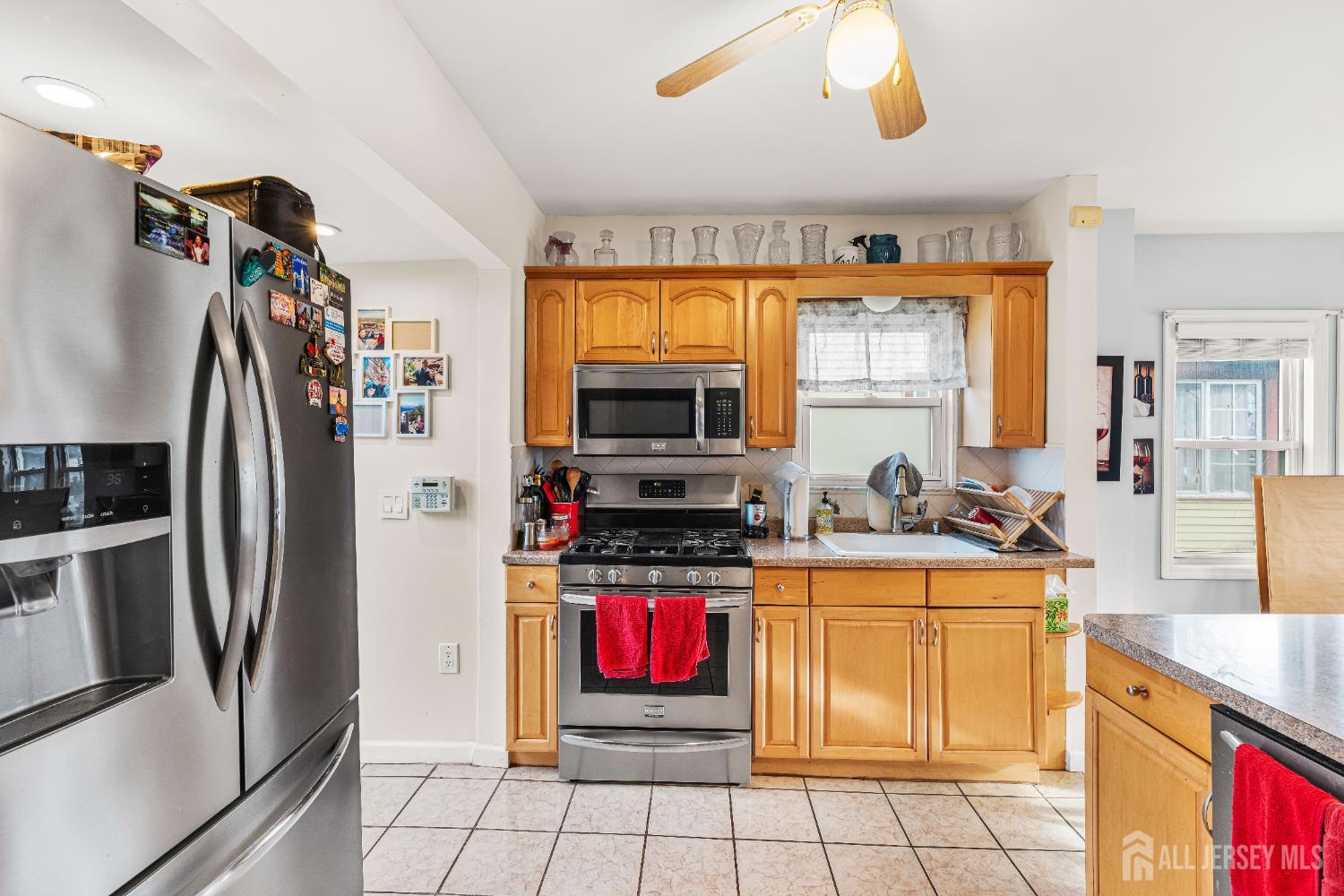 210 2nd Street Dunellen, NJ 08812 - Photo 14 of 42 a kitchen with stainless steel appliances granite countertop a refrigerator and a sink