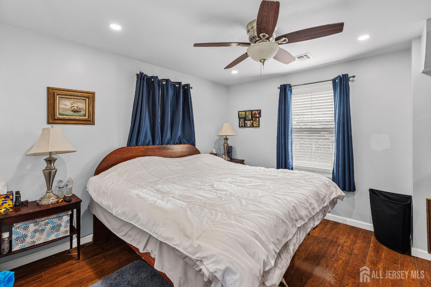 210 2nd Street Dunellen, NJ 08812 - Photo 17 of 42 a bedroom with a bed and a chandelier