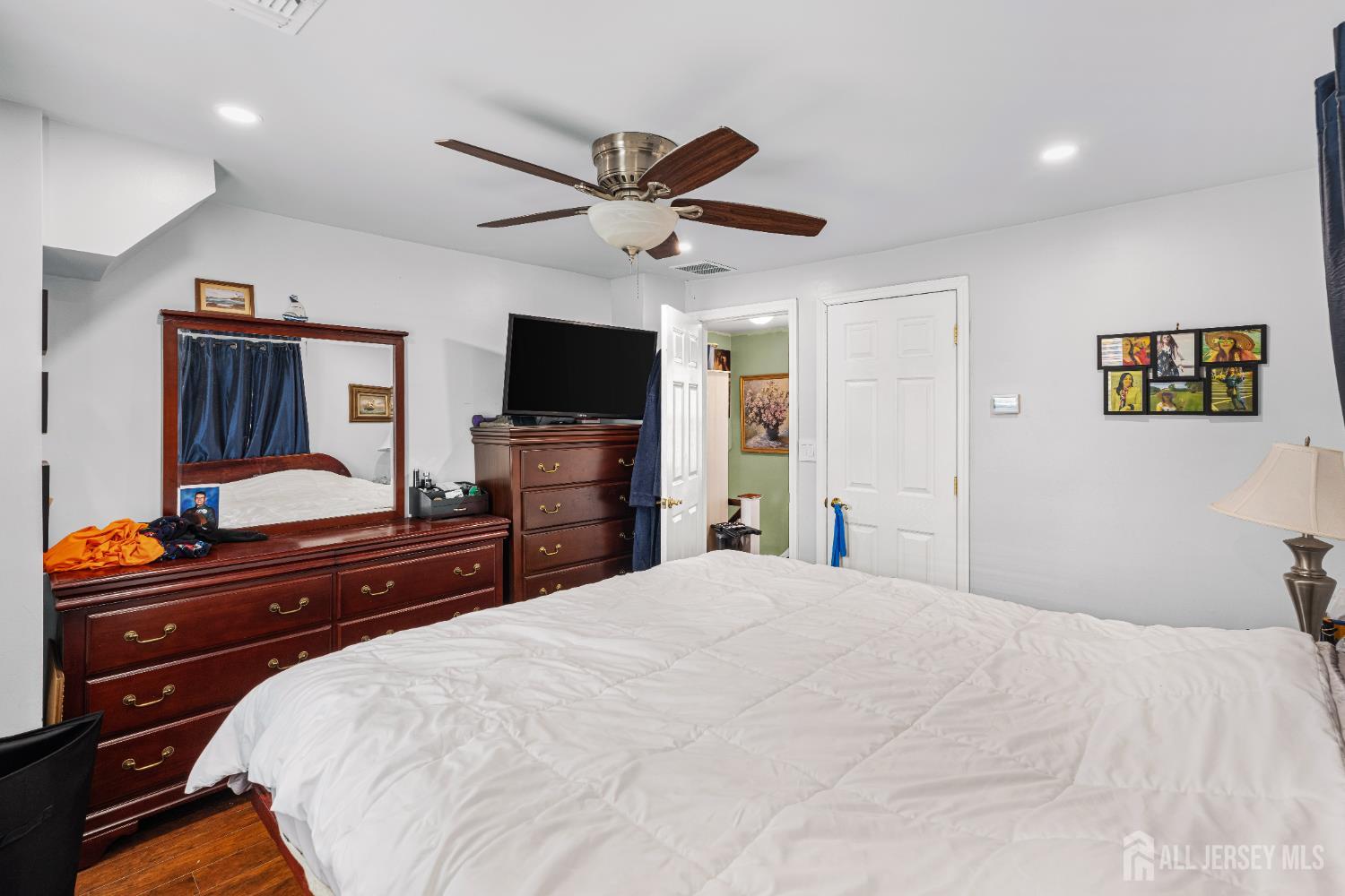210 2nd Street Dunellen, NJ 08812 - Photo 18 of 42 a bedroom with a bed and a flat screen tv