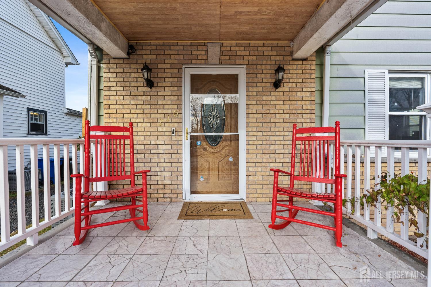 210 2nd Street Dunellen, NJ 08812 - Photo 2 of 42 a view of front door with outdoor seating