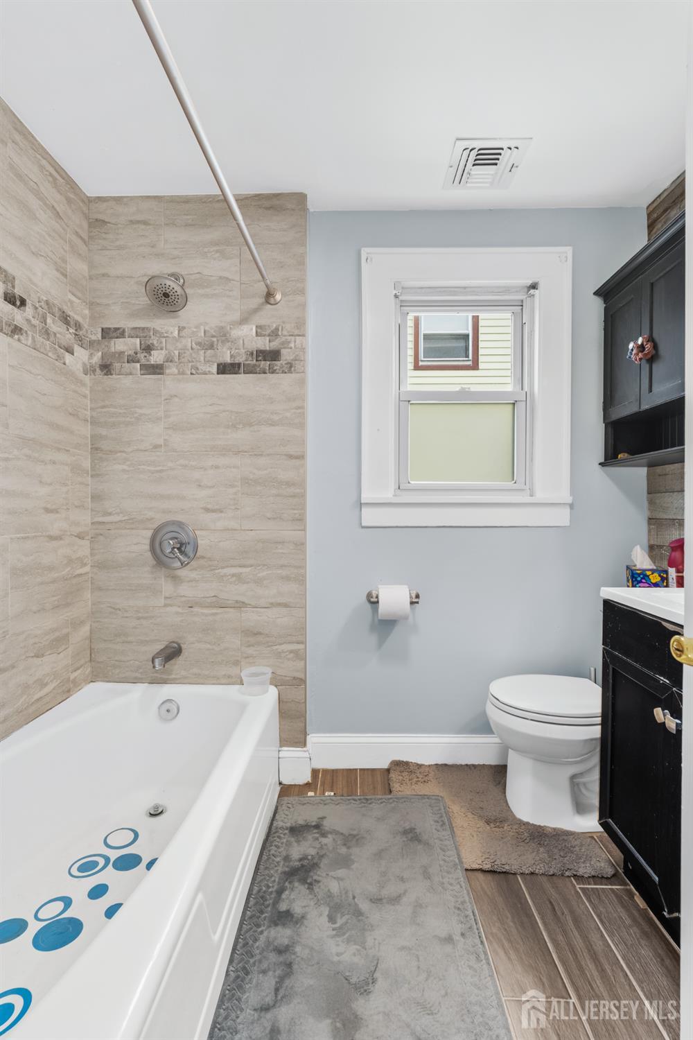 210 2nd Street Dunellen, NJ 08812 - Photo 22 of 42 a bathroom with a bathtub and a toilet