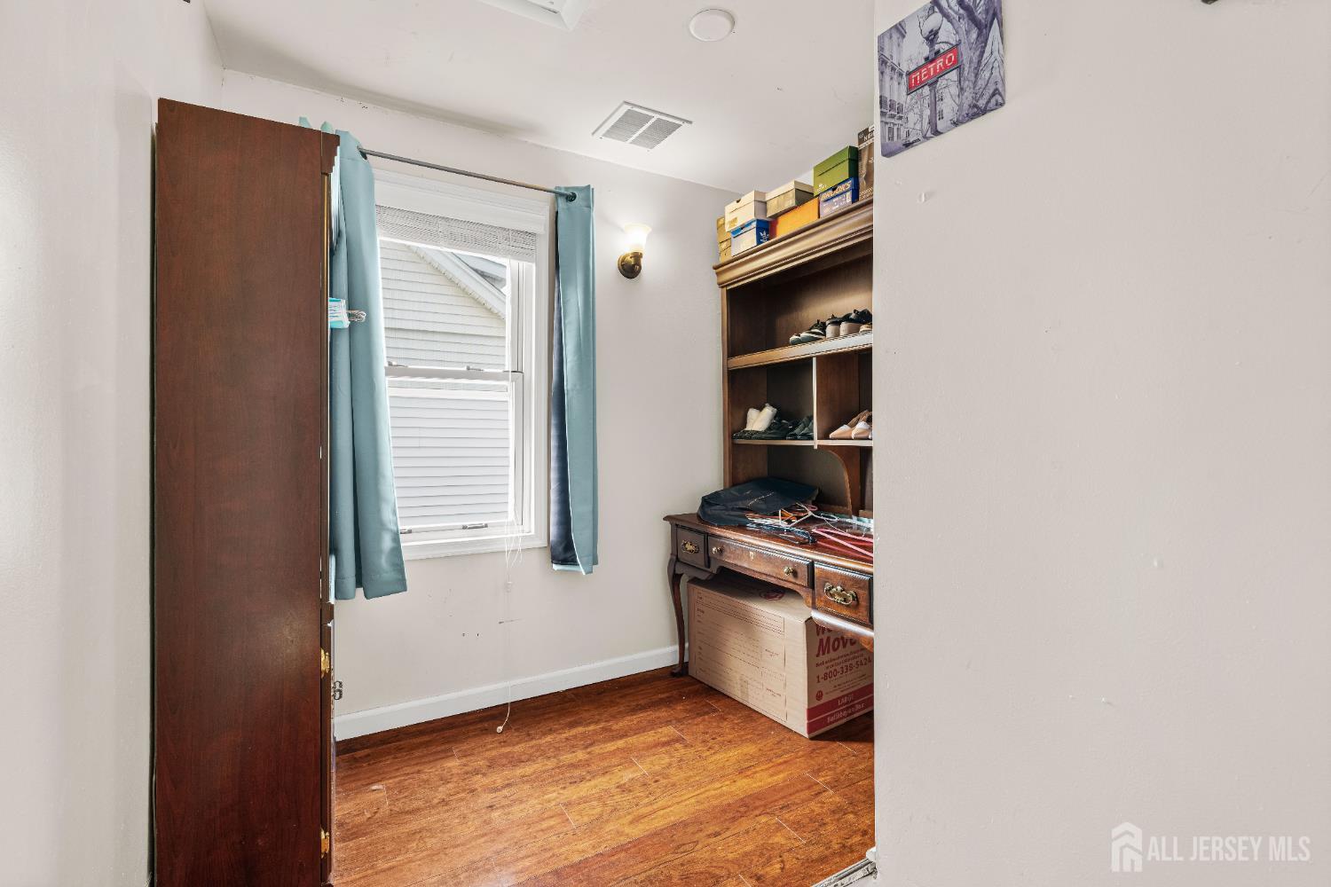 210 2nd Street Dunellen, NJ 08812 - Photo 25 of 42 a kitchen with granite countertop a sink and a stove top oven