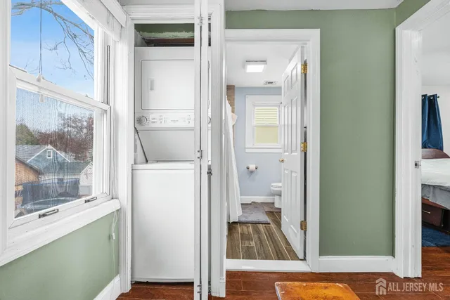 a view of a bathroom with a shower and a mirror