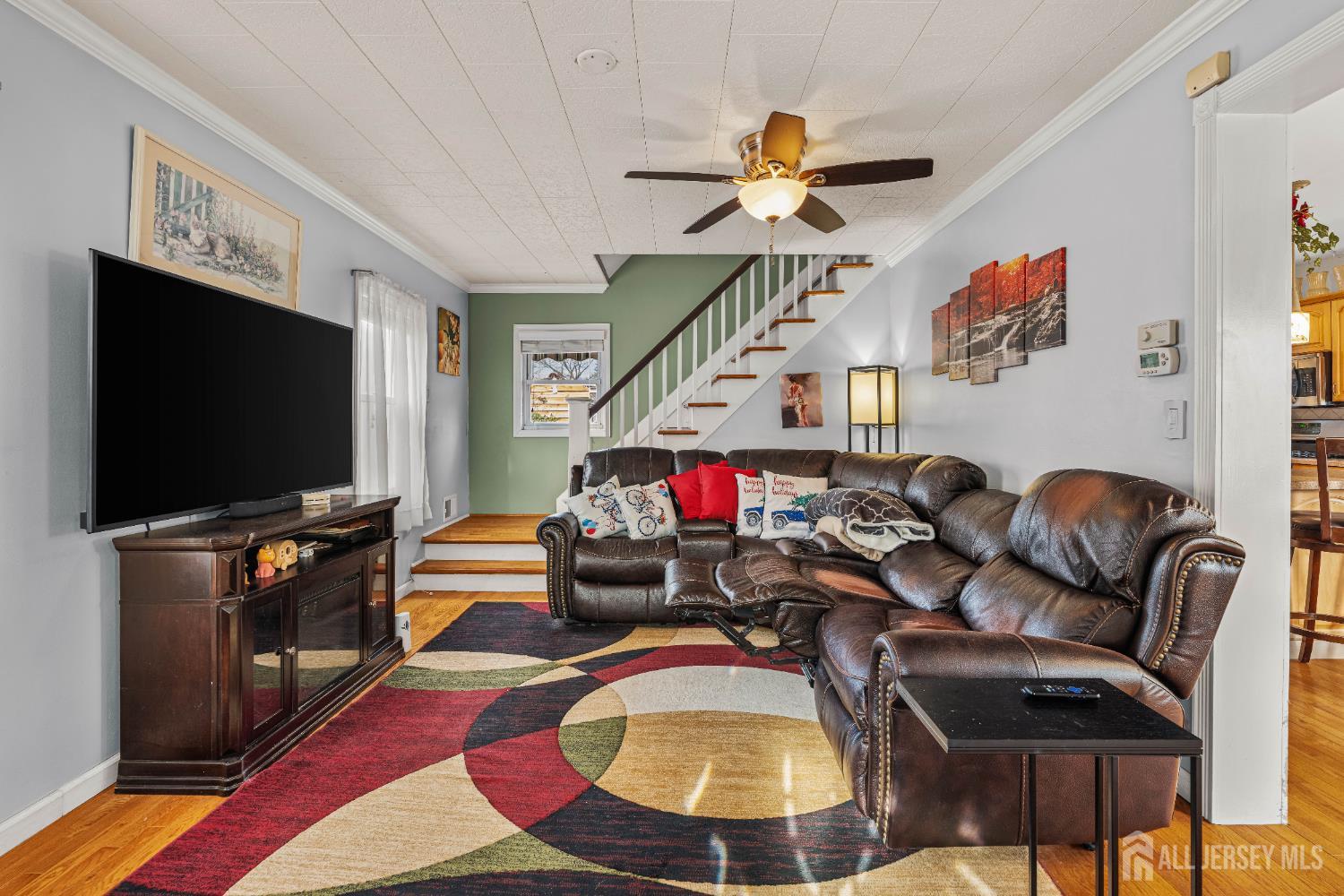210 2nd Street Dunellen, NJ 08812 - Photo 3 of 42 a living room with furniture and a flat screen tv