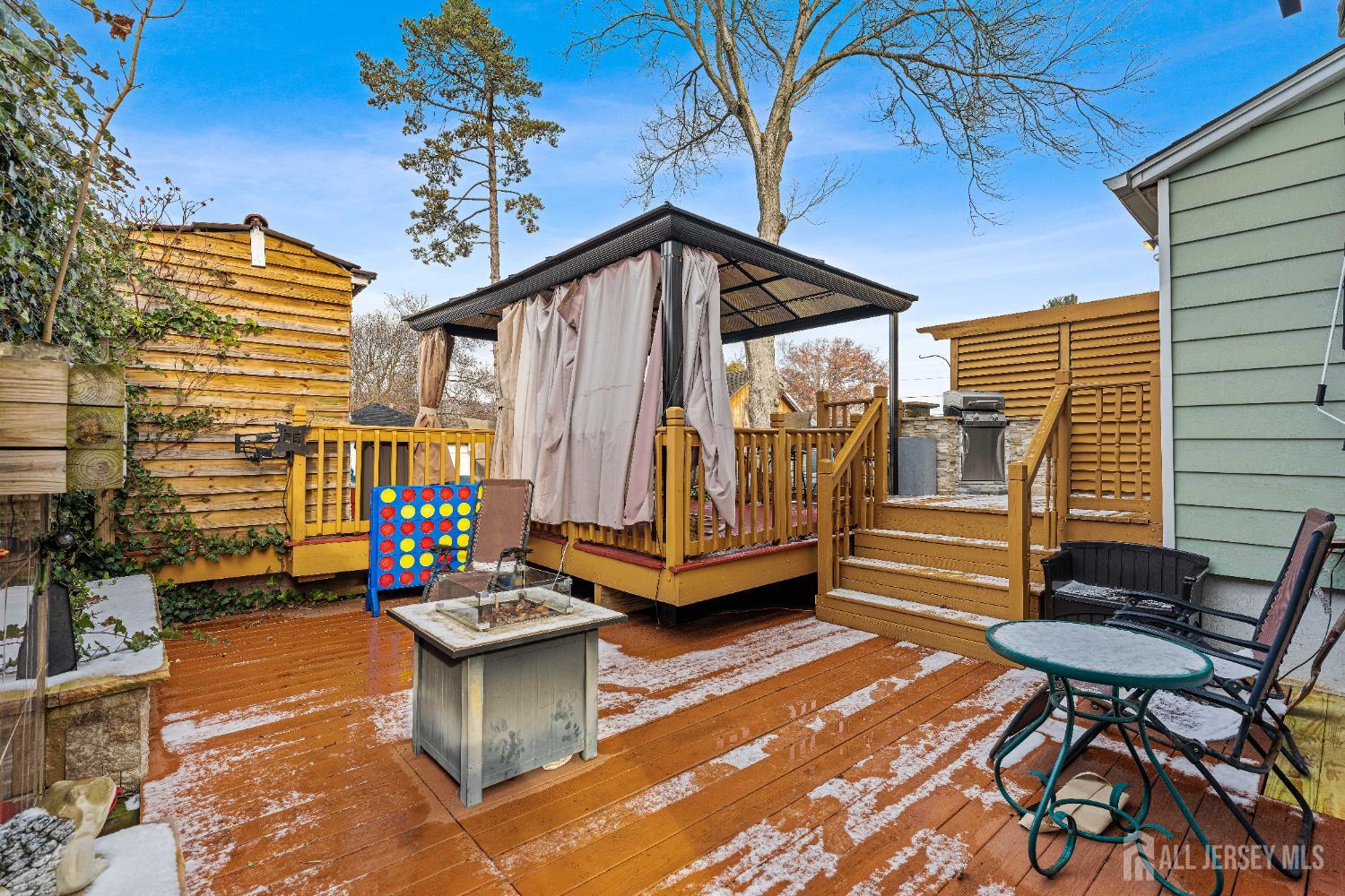210 2nd Street Dunellen, NJ 08812 - Photo 32 of 42 a backyard of a house with barbeque oven table and chairs